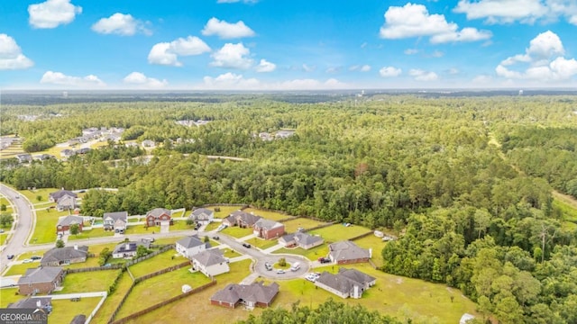 513 Cascade Ct, Hinesville, GA 31313 - aerial view of property and surrounding area featuring a heavily wooded area and nearby suburban area
