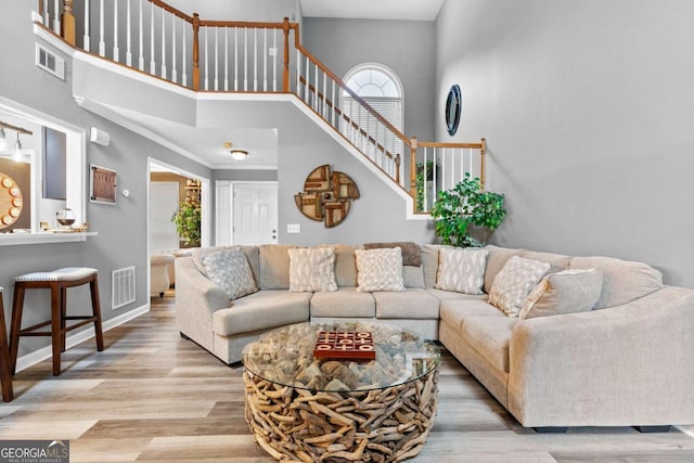 3229 Dunlin Lake Rd, Lawrenceville, GA 30044 - living room with a towering ceiling, wood finished floors, and stairs