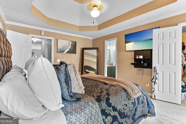 3229 Dunlin Lake Rd, Lawrenceville, GA 30044 - bedroom featuring a tray ceiling, carpet flooring, crown molding, connected bathroom, and ceiling fan