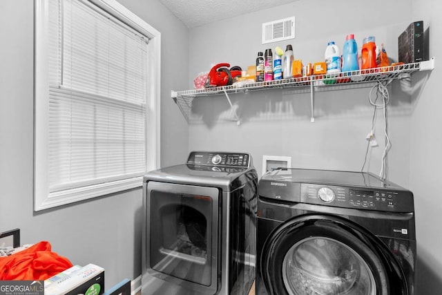 3229 Dunlin Lake Rd, Lawrenceville, GA 30044 - laundry room with independent washer and dryer and a textured ceiling