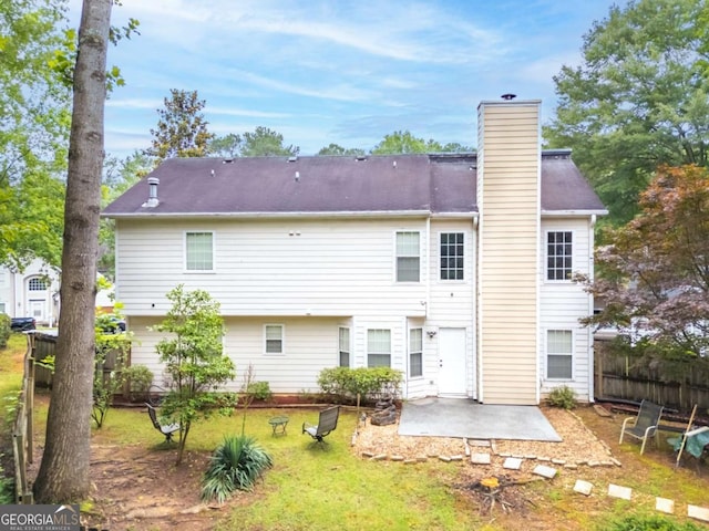 3229 Dunlin Lake Rd, Lawrenceville, GA 30044 - rear view of property with a patio and a chimney