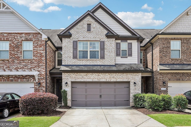 8215 Harlond Way, Suwanee, GA 30024 - view of front of property with concrete driveway, a garage, and brick siding