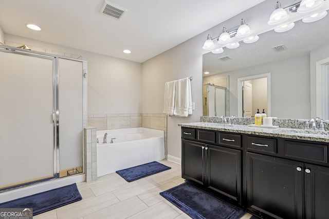 8215 Harlond Way, Suwanee, GA 30024 - bathroom featuring a shower stall, double vanity, a bath, and recessed lighting