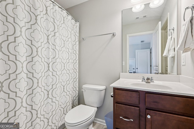 8215 Harlond Way, Suwanee, GA 30024 - bathroom featuring vanity and toilet