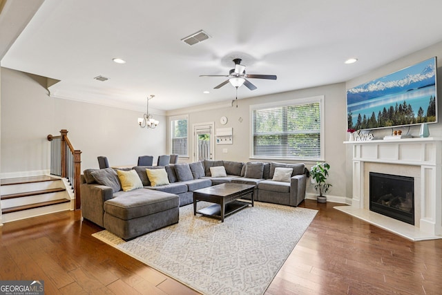 8215 Harlond Way, Suwanee, GA 30024 - living area featuring healthy amount of natural light, stairway, a ceiling fan, a high end fireplace, and recessed lighting