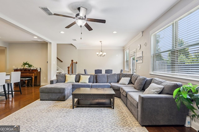 8215 Harlond Way, Suwanee, GA 30024 - living room featuring stairway, a chandelier, a ceiling fan, wood finished floors, and recessed lighting