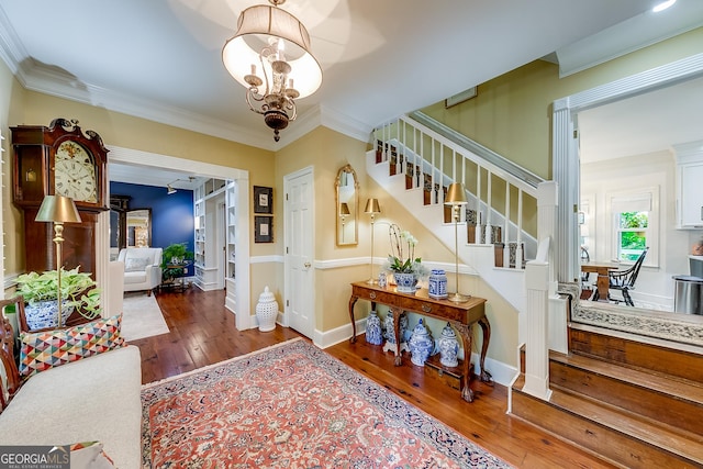 6180 Old Jefferson Rd, Athens, GA 30607 - entryway featuring stairway, wood-type flooring, ornamental molding, and a chandelier