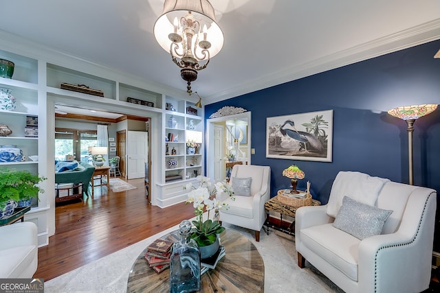 6180 Old Jefferson Rd, Athens, GA 30607 - living area with ornamental molding, wood finished floors, a chandelier, and built in features