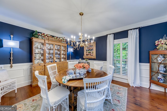 6180 Old Jefferson Rd, Athens, GA 30607 - dining room featuring a chandelier, a wainscoted wall, crown molding, wood finished floors, and a decorative wall