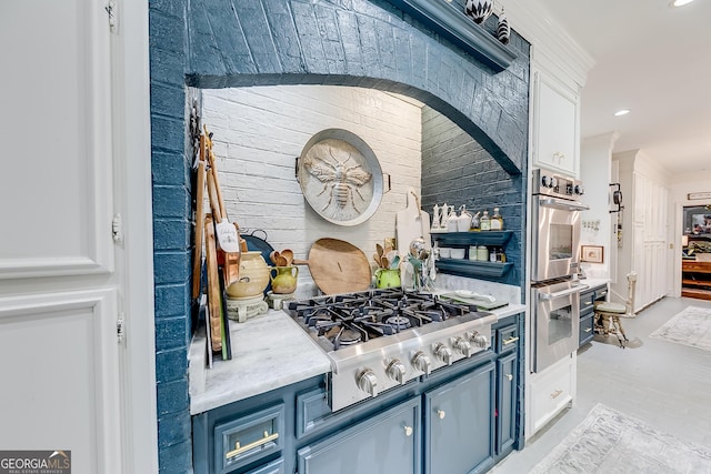6180 Old Jefferson Rd, Athens, GA 30607 - kitchen featuring appliances with stainless steel finishes, blue cabinetry, white cabinetry, recessed lighting, and light countertops