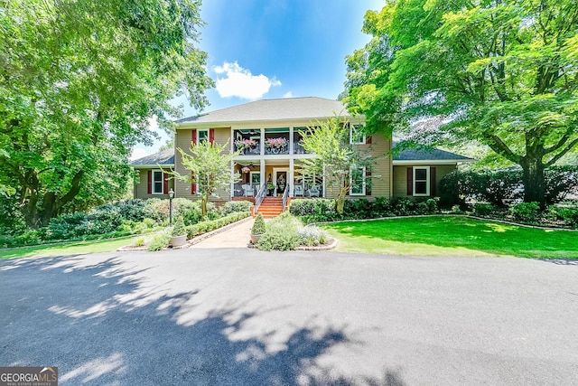 6180 Old Jefferson Rd, Athens, GA 30607 - view of front of home with a porch, a front yard, and a balcony