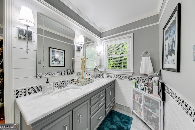 6180 Old Jefferson Rd, Athens, GA 30607 - bathroom with crown molding, double vanity, tile walls, and a wainscoted wall