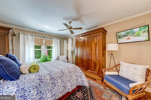 6180 Old Jefferson Rd, Athens, GA 30607 - bedroom with wood finished floors, ornamental molding, and ceiling fan