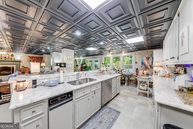 6180 Old Jefferson Rd, Athens, GA 30607 - kitchen featuring an ornate ceiling, dishwasher, open floor plan, white cabinetry, and light stone countertops