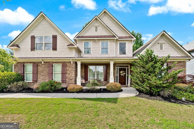 1626 Waterchase Dr, Dacula, GA 30019 - craftsman-style house with a porch, a front lawn, a standing seam roof, and a metal roof