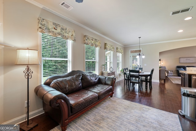 1626 Waterchase Dr, Dacula, GA 30019 - living room with dark wood-style floors, crown molding, arched walkways, and recessed lighting