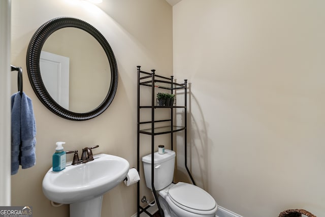1626 Waterchase Dr, Dacula, GA 30019 - half bathroom with a sink and toilet