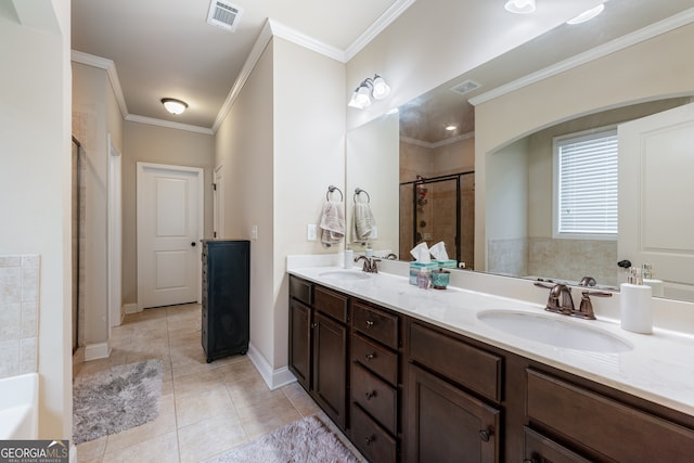 1626 Waterchase Dr, Dacula, GA 30019 - full bathroom featuring a stall shower, double vanity, crown molding, tile patterned flooring, and a bath