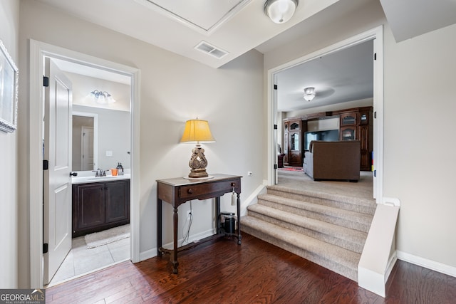 1626 Waterchase Dr, Dacula, GA 30019 - corridor with wood finished floors and a sink