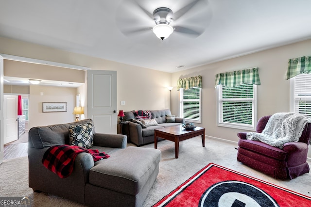 1626 Waterchase Dr, Dacula, GA 30019 - carpeted living room featuring ceiling fan and healthy amount of natural light