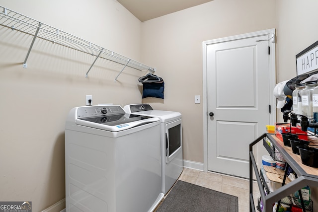 1626 Waterchase Dr, Dacula, GA 30019 - washroom with washer and clothes dryer and light tile patterned floors