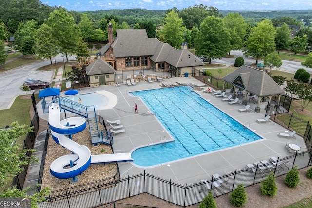 1626 Waterchase Dr, Dacula, GA 30019 - community pool featuring a water slide and a patio