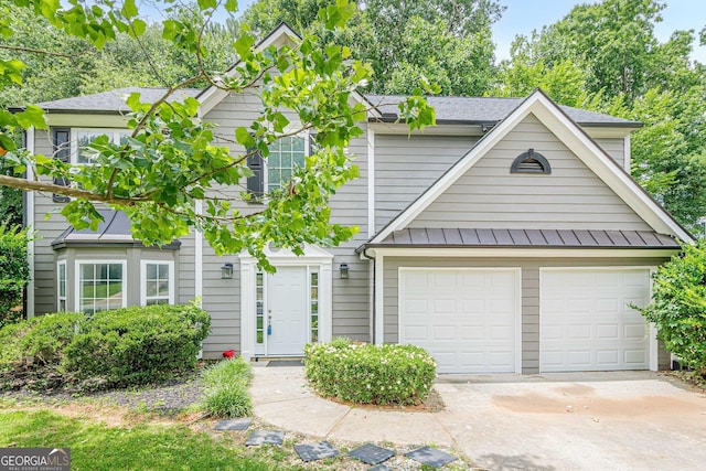 4959 Abbotts Glen Trl NW, Acworth, GA 30101 - view of front of property featuring driveway, a garage, a standing seam roof, roof with shingles, and a metal roof