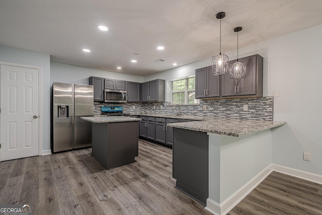 4959 Abbotts Glen Trl NW, Acworth, GA 30101 - kitchen with stainless steel appliances, dark wood-style floors, a peninsula, backsplash, and recessed lighting