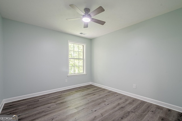 4959 Abbotts Glen Trl NW, Acworth, GA 30101 - empty room with wood finished floors and a ceiling fan