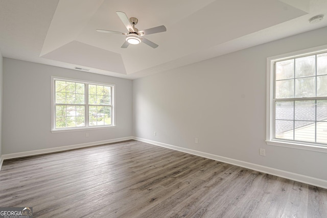4959 Abbotts Glen Trl NW, Acworth, GA 30101 - unfurnished room with a raised ceiling, a smoke detector, wood finished floors, and a ceiling fan