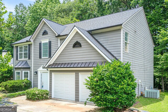 4959 Abbotts Glen Trl NW, Acworth, GA 30101 - view of front of property with driveway, roof with shingles, a garage, and a standing seam roof