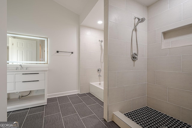 4959 Abbotts Glen Trl NW, Acworth, GA 30101 - bathroom featuring vanity, tiled shower / bath, and recessed lighting