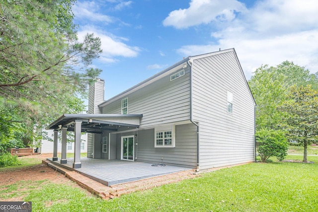 4959 Abbotts Glen Trl NW, Acworth, GA 30101 - rear view of house featuring a yard, a chimney, and a deck