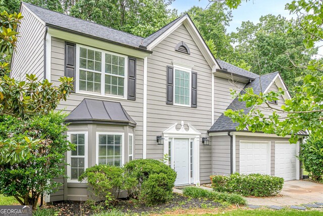 4959 Abbotts Glen Trl NW, Acworth, GA 30101 - view of front of home with concrete driveway, a shingled roof, and an attached garage