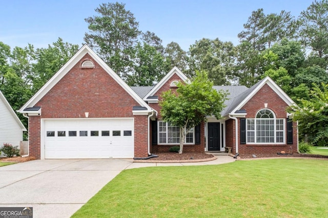 192 Sandhurst Ct, Suwanee, GA 30024 - view of front of house featuring concrete driveway, a front yard, a garage, and brick siding