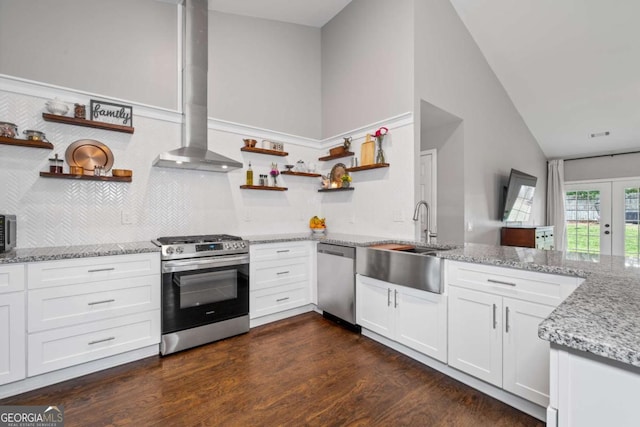 192 Sandhurst Ct, Suwanee, GA 30024 - kitchen with open shelves, stainless steel appliances, vaulted ceiling, light stone counters, and dark wood-style floors