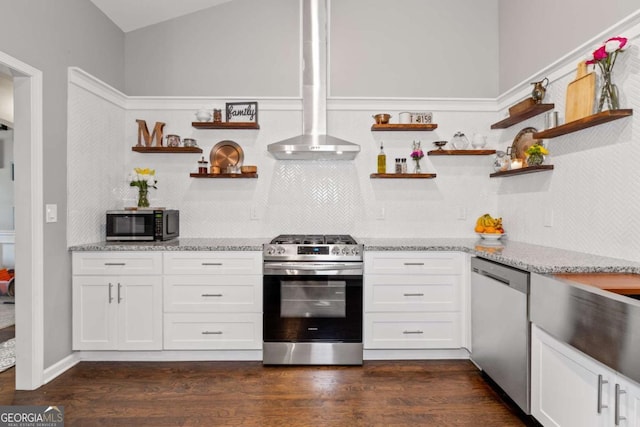 192 Sandhurst Ct, Suwanee, GA 30024 - kitchen featuring appliances with stainless steel finishes, open shelves, tasteful backsplash, white cabinetry, and light stone countertops