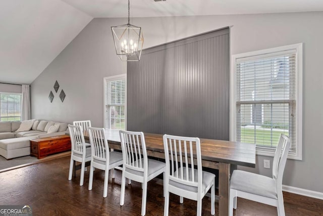 192 Sandhurst Ct, Suwanee, GA 30024 - dining room with a chandelier, vaulted ceiling, and wood finished floors