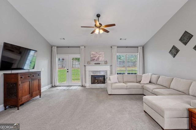 192 Sandhurst Ct, Suwanee, GA 30024 - living area featuring ceiling fan, light carpet, and a premium fireplace