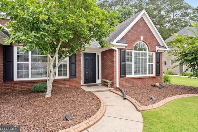 192 Sandhurst Ct, Suwanee, GA 30024 - view of front of home with brick siding and a shingled roof
