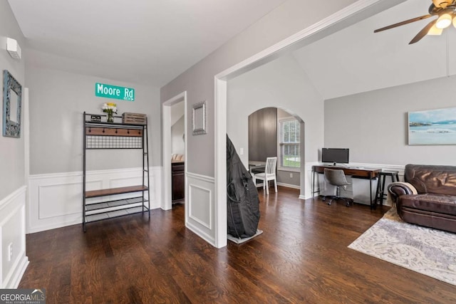 192 Sandhurst Ct, Suwanee, GA 30024 - living area featuring arched walkways, ceiling fan, wood finished floors, an office area, and a wainscoted wall