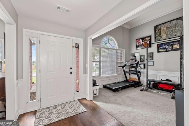 192 Sandhurst Ct, Suwanee, GA 30024 - foyer featuring wainscoting, wood finished floors, and a decorative wall
