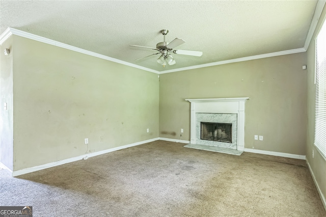 3376 Trotters Ridge Trl, Gray, GA 31032 - unfurnished living room with carpet flooring, ceiling fan, a premium fireplace, a textured ceiling, and crown molding