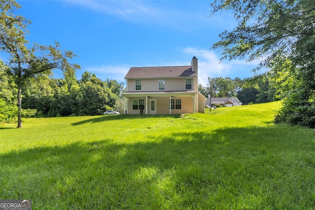3376 Trotters Ridge Trl, Gray, GA 31032 - back of property featuring a chimney and a lawn