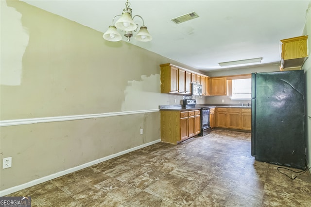 3376 Trotters Ridge Trl, Gray, GA 31032 - kitchen with range with electric stovetop, freestanding refrigerator, stainless steel microwave, a chandelier, and decorative light fixtures