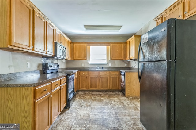 3376 Trotters Ridge Trl, Gray, GA 31032 - kitchen featuring black appliances, stone finish floors, washer / dryer, brown cabinetry, and dark countertops