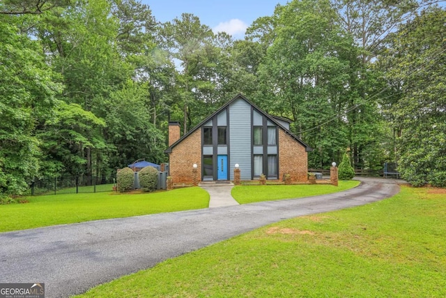 1605 Saint Tropez Way, Atlanta, GA 30350 - view of front of house with a chimney and brick siding