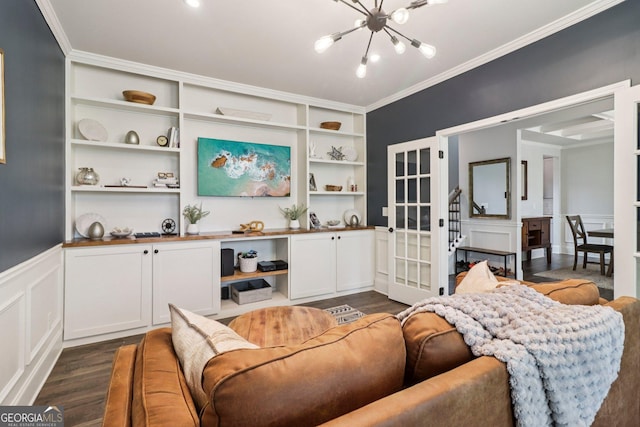 1564 Brunswick St, Lithia Springs, GA 30122 - living room with a chandelier, french doors, dark wood-type flooring, ornamental molding, and built in shelves