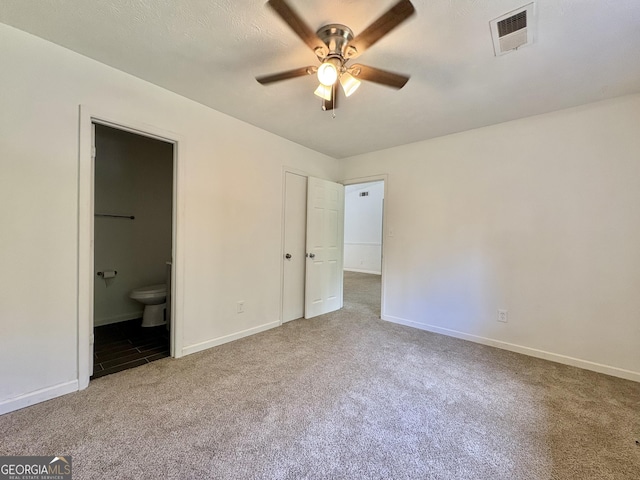 10173 Brass Ring Rd, Jonesboro, GA 30238 - unfurnished bedroom featuring carpet, ensuite bath, and a ceiling fan