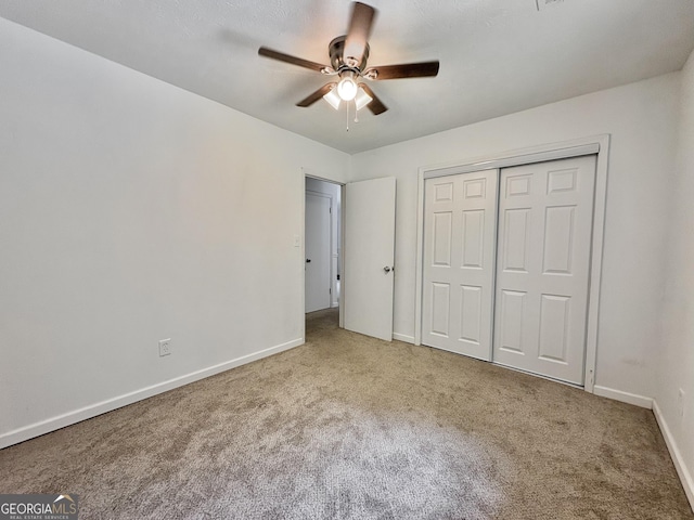 10173 Brass Ring Rd, Jonesboro, GA 30238 - unfurnished bedroom with carpet, a closet, and ceiling fan